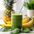Super_greens_powder_drink with pineapple_bananas_spinach in frame